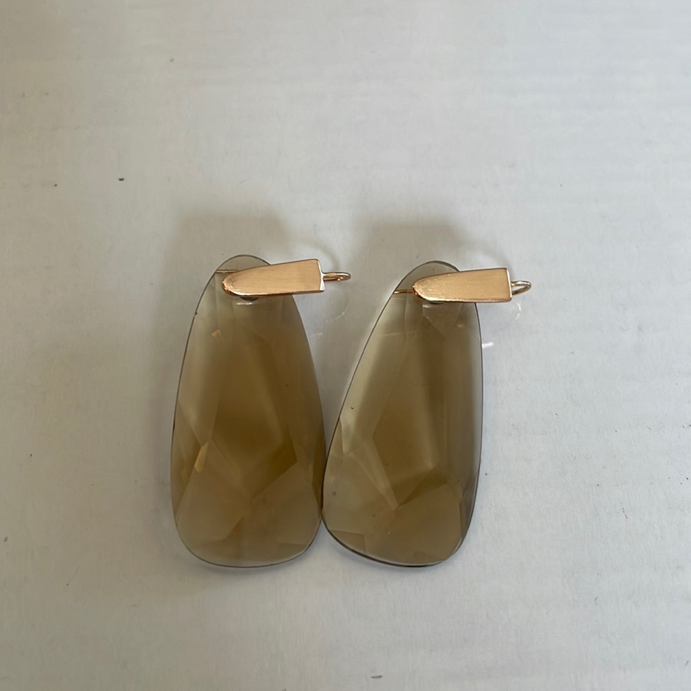 Kendra Scott rose gold metal with a topaz stone